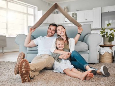 Happy family, portrait and roof with daughter for safety, security or property investment at home. Mother, father and young child or kid with smile on floor for shelter, apartment or house together.